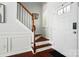 Welcoming entryway with hardwood floors, staircase, and natural light streaming through the door at 8504 Sunset Hill Rd, Waxhaw, NC 28173