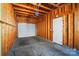 Spacious garage with exposed wooden beams and a door, providing ample storage or parking at 8504 Sunset Hill Rd, Waxhaw, NC 28173
