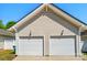 Two-car garage with white doors, showcasing a well-maintained exterior at 8504 Sunset Hill Rd, Waxhaw, NC 28173