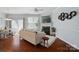 Open-concept living space with access to dining area and outdoor patio; fireplace feature at 8504 Sunset Hill Rd, Waxhaw, NC 28173