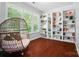 Cozy living room with a wicker chair, built in bookcases, and natural light at 8504 Sunset Hill Rd, Waxhaw, NC 28173
