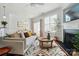 Comfortable living room showcasing a fireplace, natural light, and seamless access to the dining area at 8504 Sunset Hill Rd, Waxhaw, NC 28173