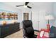 Home office featuring a work station, storage cabinet, artwork and double door closet at 8504 Sunset Hill Rd, Waxhaw, NC 28173