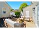 Charming outdoor patio with stylish seating, complemented by lush landscaping at 8504 Sunset Hill Rd, Waxhaw, NC 28173