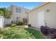 Landscaped backyard and patio area, with a lush lawn and manicured garden at 8524 Sunset Hill Rd, Waxhaw, NC 28173