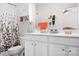 Bright bathroom featuring a double sink vanity, mirror and decorative accents at 8524 Sunset Hill Rd, Waxhaw, NC 28173