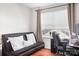 Bedroom featuring a futon, desk, and window with blind at 8524 Sunset Hill Rd, Waxhaw, NC 28173