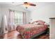 Primary bedroom with vaulted ceiling, ceiling fan, and large window at 8524 Sunset Hill Rd, Waxhaw, NC 28173