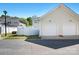 View of the two-car garage and vinyl fence under a clear blue sky at 8524 Sunset Hill Rd, Waxhaw, NC 28173