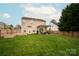 Spacious backyard with a patio, garden, and pergola, perfect for outdoor living and entertaining at 8604 Cedardale Ridge Ct, Charlotte, NC 28269
