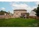 Large backyard with patio, garden, and pergola, offering ample space for relaxation and recreation at 8604 Cedardale Ridge Ct, Charlotte, NC 28269