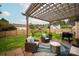 Inviting backyard patio with a pergola, comfortable seating, and a grill, great for outdoor entertaining at 8604 Cedardale Ridge Ct, Charlotte, NC 28269
