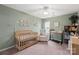 Charming Bedroom room with crib, changing table, rocking chair and natural light at 8604 Cedardale Ridge Ct, Charlotte, NC 28269
