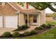 Charming front entrance with a well-kept lawn and manicured landscaping, creating a welcoming atmosphere at 8604 Cedardale Ridge Ct, Charlotte, NC 28269