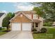 Attractive two-story home with a two-car garage and nicely landscaped front yard, showcasing curb appeal at 8604 Cedardale Ridge Ct, Charlotte, NC 28269