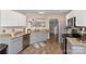 A well-lit kitchen featuring stainless steel appliances, wood floors and granite countertops at 8604 Cedardale Ridge Ct, Charlotte, NC 28269