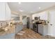 A well-lit kitchen featuring stainless steel appliances and ample granite counter space at 8604 Cedardale Ridge Ct, Charlotte, NC 28269