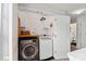 A convenient laundry room with modern appliances and ample storage space at 8604 Cedardale Ridge Ct, Charlotte, NC 28269
