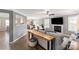 Spacious living room with an open floor plan and fireplace seamlessly connects to the dining area at 8604 Cedardale Ridge Ct, Charlotte, NC 28269