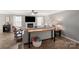 Open living room boasts a fireplace, ceiling fan, and ample natural light from many windows at 8604 Cedardale Ridge Ct, Charlotte, NC 28269