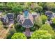 Stunning aerial view showcasing the home, pool, lush landscaping, and surrounding greenery at 8934 Winged Bourne Dr, Charlotte, NC 28210