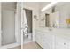 Bathroom featuring a walk-in shower, white cabinets, and modern fixtures at 8934 Winged Bourne Dr, Charlotte, NC 28210