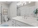 Bathroom featuring a walk-in shower, vanity with mirror and lighting, and white tile flooring at 8934 Winged Bourne Dr, Charlotte, NC 28210