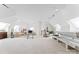 Spacious bonus room featuring carpet flooring, skylights, and comfortable seating areas at 8934 Winged Bourne Dr, Charlotte, NC 28210