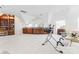 Large bonus room with carpet flooring, built-in cabinets, mirror wall, and exercise equipment at 8934 Winged Bourne Dr, Charlotte, NC 28210