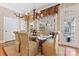 Dining room with chandelier and access to outdoor living and kitchen at 8934 Winged Bourne Dr, Charlotte, NC 28210