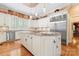 Bright eat-in kitchen with stainless steel appliances, granite countertops and custom cabinetry at 8934 Winged Bourne Dr, Charlotte, NC 28210