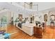 Open-concept living room with hardwood floors, fireplace, custom built-ins, and elegant decor at 8934 Winged Bourne Dr, Charlotte, NC 28210