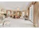 This bedroom features a tray ceiling, white carpet, and access to a private balcony at 8934 Winged Bourne Dr, Charlotte, NC 28210
