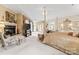 Spacious primary bedroom with sitting area, fireplace, ensuite bath and tray ceilings at 8934 Winged Bourne Dr, Charlotte, NC 28210