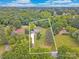 Aerial view of a property in a wooded area with boundary lines shown at 915 Gate Rd, Monroe, NC 28112