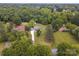 Aerial view of a charming home nestled within lush green foliage at 915 Gate Rd, Monroe, NC 28112