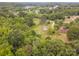 Aerial view of a residence surrounded by dense, verdant trees and vegetation at 915 Gate Rd, Monroe, NC 28112