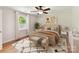 Staged bedroom with rug, bench, large window, and coordinating artwork at 915 Gate Rd, Monroe, NC 28112