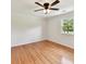 Bright bedroom with hardwood floors, a ceiling fan, and a window offering a natural light and airy ambiance at 915 Gate Rd, Monroe, NC 28112