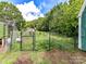 Exterior view of a fenced garden plot, perfect for growing fresh produce at 915 Gate Rd, Monroe, NC 28112