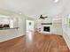 Spacious living room with hardwood floors, a fireplace, and built-in shelving, perfect for entertaining at 915 Gate Rd, Monroe, NC 28112