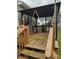 A wooden back deck that features stairs and overhead covering at 932 3Rd Street Sw Pl, Hickory, NC 28602