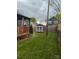 A grassy backyard that features a covered deck and a small shed at 932 3Rd Street Sw Pl, Hickory, NC 28602