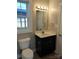 Cozy bathroom featuring a vanity with storage, a well-lit mirror, and modern fixtures at 932 3Rd Street Sw Pl, Hickory, NC 28602