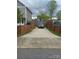 A long driveway that is fenced in and can fit multiple cars at 932 3Rd Street Sw Pl, Hickory, NC 28602