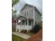 Charming two-story home with a welcoming front porch and landscaped yard, perfect for relaxing outdoors at 932 3Rd Street Sw Pl, Hickory, NC 28602