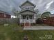 Charming two-story home with a cozy front porch and manicured lawn at 932 3Rd Street Sw Pl, Hickory, NC 28602