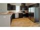 Modern kitchen with stainless steel appliances, granite countertops, and ample cabinet space for storage at 932 3Rd Street Sw Pl, Hickory, NC 28602