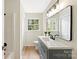 Bathroom features a long vanity with modern fixtures and a shower at 103 Colonel Richard Rankin Dr, Stanley, NC 28164