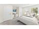 Cozy bedroom showcasing neutral decor, a comfortable bed, carpet floors, and ample natural light at 103 Colonel Richard Rankin Dr, Stanley, NC 28164